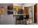 Bright kitchen features wooden cabinets, stainless appliances, and breakfast bar with seating at 43 Snowflake Dr # D7, Breckenridge, CO 80424