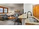 Stylish kitchen area open to living room, featuring granite countertops at 43 Snowflake Dr # D7, Breckenridge, CO 80424