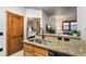 Open floor plan with kitchen bar connecting to living area and bedroom view at 43 Snowflake Dr # D7, Breckenridge, CO 80424