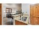 Kitchen bar overlooking the living area with seating at 43 Snowflake Dr # D7, Breckenridge, CO 80424