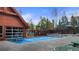 Inviting outdoor community pool enclosed by a wall, offering a blend of privacy and open-air recreation at 43 Snowflake Dr # D7, Breckenridge, CO 80424