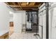 Basement with a closet and clothes rack with easy access to the laundry at 7695 S Sheridan Ct, Littleton, CO 80128