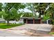 Charming single-story home with a spacious driveway and a well-maintained front lawn, perfect for Gathering living at 7695 S Sheridan Ct, Littleton, CO 80128