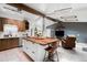 Spacious kitchen featuring a large island, stainless steel appliances, and an open floor plan at 7695 S Sheridan Ct, Littleton, CO 80128
