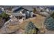 Aerial view of the house and property with patio seating area at 6236 S Robertsdale Ct, Aurora, CO 80016