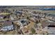 Aerial view of houses in neighborhood with solar panels and lake in the background at 6236 S Robertsdale Ct, Aurora, CO 80016