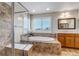 Bright bathroom with a soaking tub, walk-in shower, and tiled accents at 6236 S Robertsdale Ct, Aurora, CO 80016
