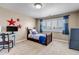 Bedroom with bright window, patriotic decor, carpet, and desk area at 6236 S Robertsdale Ct, Aurora, CO 80016