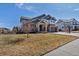 Charming two-story home with a covered porch, manicured lawn, and a two-car garage at 6236 S Robertsdale Ct, Aurora, CO 80016