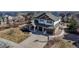 Beautiful two-story home with a three-car garage and manicured landscaping at 6236 S Robertsdale Ct, Aurora, CO 80016