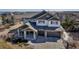 Charming two-story home with a three-car garage and covered front porch at 6236 S Robertsdale Ct, Aurora, CO 80016
