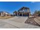 Well-maintained two-story home with stone accents, spacious driveway, and attached two-car garage at 6236 S Robertsdale Ct, Aurora, CO 80016
