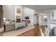 Open-concept living room features a fireplace, high ceilings, and hardwood floors at 6236 S Robertsdale Ct, Aurora, CO 80016