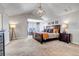 Spacious main bedroom featuring vaulted ceilings and a seating area bathed in natural light at 6236 S Robertsdale Ct, Aurora, CO 80016