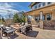 Rear patio with firepit and outdoor seating, built-in grill at 6236 S Robertsdale Ct, Aurora, CO 80016