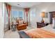 Relaxing sitting area in main bedroom featuring a cozy chair and bright window at 6236 S Robertsdale Ct, Aurora, CO 80016