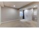 Finished basement area with carpet, a window with blinds, and a closet, providing ample space at 13241 Heart Lake Way, Broomfield, CO 80020