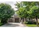 Charming two-story home with a brick-accented three-car garage and inviting front porch at 13241 Heart Lake Way, Broomfield, CO 80020