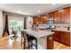 Modern kitchen featuring stainless steel appliances, a center island, and a breakfast nook at 13241 Heart Lake Way, Broomfield, CO 80020