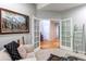 Inviting living room with french doors, neutral decor, and hardwood floors visible at 13241 Heart Lake Way, Broomfield, CO 80020
