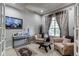 Cozy living room featuring neutral tones, comfortable seating, and ample natural light at 13241 Heart Lake Way, Broomfield, CO 80020