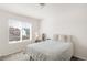 Bright bedroom with neutral colors, a window, and carpeted floor provides a calming retreat at 5032 S Valdai Way, Aurora, CO 80015