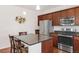 Well-equipped kitchen featuring stainless steel appliances, ample cabinet space, and granite countertops at 5032 S Valdai Way, Aurora, CO 80015