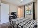 Bedroom with neutral walls, carpet flooring, window and desk at 15642 E Eldorado Dr, Aurora, CO 80013