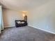 Spacious living area featuring soft carpeting, and a comfy couch, providing a blank canvas for personal style at 15642 E Eldorado Dr, Aurora, CO 80013