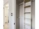 Functional closet features built-in shelving and a view into an adjacent bedroom at 885 Kenton St, Aurora, CO 80010