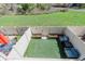 Aerial view of private backyard with artificial turf, planters and outdoor seating at 9671 W Chatfield Ave # B, Littleton, CO 80128