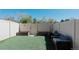 Cozy backyard features artificial turf and outdoor seating, perfect for relaxing and entertaining at 9671 W Chatfield Ave # B, Littleton, CO 80128