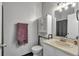 Neutral bathroom with modern cabinets, a single vanity and lots of light at 9671 W Chatfield Ave # B, Littleton, CO 80128