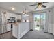 Bright eat-in kitchen with stainless steel appliances and sliding doors to the backyard at 9671 W Chatfield Ave # B, Littleton, CO 80128