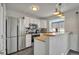 Well-lit kitchen with stainless steel appliances and ample counter space at 9671 W Chatfield Ave # B, Littleton, CO 80128