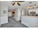 Open living space connecting the living room, stairs, and kitchen area at 9671 W Chatfield Ave # B, Littleton, CO 80128