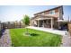 Spacious backyard with healthy lawn, patio, hot tub, seating, and privacy fence at 27790 E 9Th Pl, Aurora, CO 80018