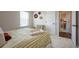 Cozy bedroom with natural light, neutral walls and minimal decor creates a calming space at 27790 E 9Th Pl, Aurora, CO 80018