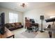 Functional home office featuring modern furniture and a comfortable seating area at 27790 E 9Th Pl, Aurora, CO 80018