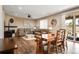 Open-concept living area with hardwood floors, natural light, and dining table at 27790 E 9Th Pl, Aurora, CO 80018