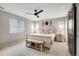 Inviting main bedroom showcasing neutral tones, wooden furniture, and a ceiling fan at 27790 E 9Th Pl, Aurora, CO 80018