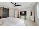 Bright main bedroom boasts a ceiling fan and access to an ensuite bathroom at 27790 E 9Th Pl, Aurora, CO 80018