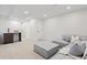 Open basement space featuring a cozy seating area and a convenient wet bar at 1727 Lowell Blvd, Denver, CO 80204