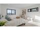 Bright bedroom featuring a large window with view, modern decor, and recessed lighting at 1727 Lowell Blvd, Denver, CO 80204