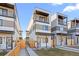 Modern two-story home featuring a covered porch, balcony, and contemporary design at 1727 Lowell Blvd, Denver, CO 80204