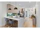 Modern kitchen with stainless steel appliances, quartz countertops, and hardwood floors at 1727 Lowell Blvd, Denver, CO 80204