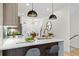 Modern kitchen with stainless steel appliances, quartz countertops, and hardwood floors at 1727 Lowell Blvd, Denver, CO 80204