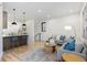 Open-concept living space with modern decor, hardwood floors, and bright, neutral color scheme at 1727 Lowell Blvd, Denver, CO 80204