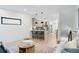 Open-concept living space with modern decor, hardwood floors, and bright, neutral color scheme at 1727 Lowell Blvd, Denver, CO 80204