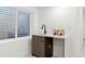 Charming wet bar area with a modern sink, countertop, and wine storage at 1727 Lowell Blvd, Denver, CO 80204